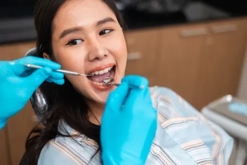 patient receiving a dental examination for gum care
