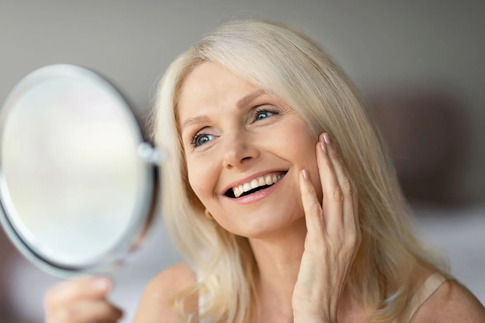 Patient smiling after restorative dental care.