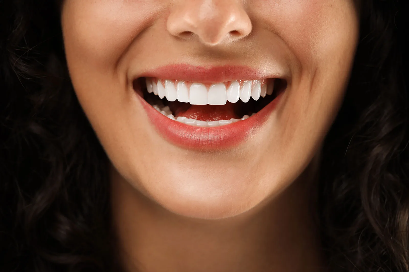 Patient smiling after cosmetic dental care.
